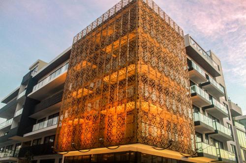 a tall building with a lot of lights on it at IT Boutique Hotel & Restaurant in Playa del Carmen