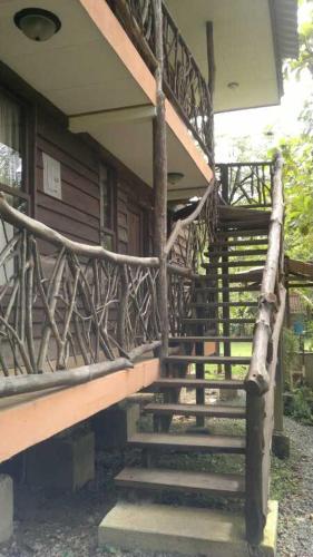 a set of stairs leading to a house at Villas Maria Luisa in Uvita