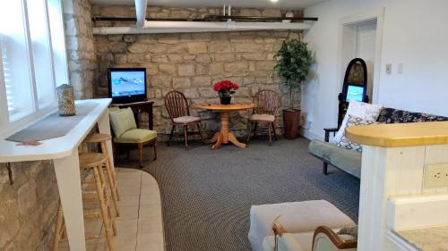 a living room with a table and chairs at Alexander Mansion Bed & Breakfast in Winona