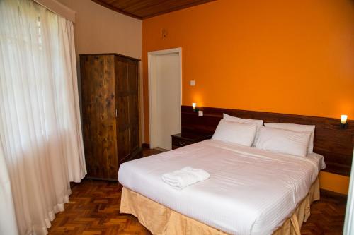 Postel nebo postele na pokoji v ubytování Thayu Farm Hotel