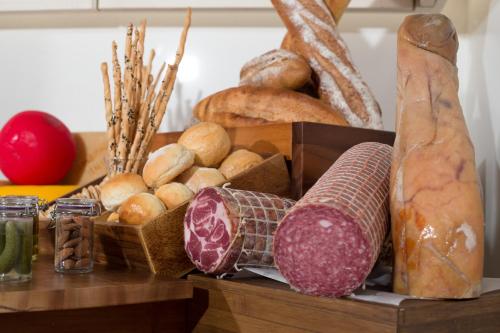 a box filled with lots of different types of bread at Lancaster Bangkok in Bangkok