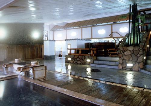 a large room with a wooden floor in a church at Tabist Kinugawa Park Cottage in Nikko