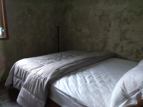 Säng eller sängar i ett rum på Griyo Jagalan