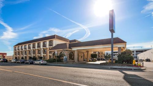 a large building on the side of a street at Best Western Norwalk Inn in Norwalk