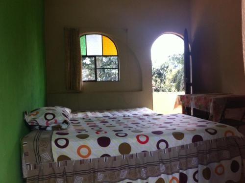 En eller flere senger på et rom på Hotel Paraíso