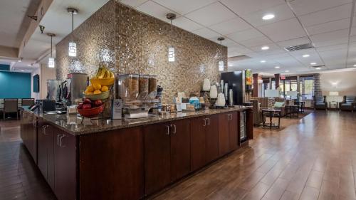 a lobby with a counter with fruit on it at Best Western Plus Galleria Inn & Suites in Memphis