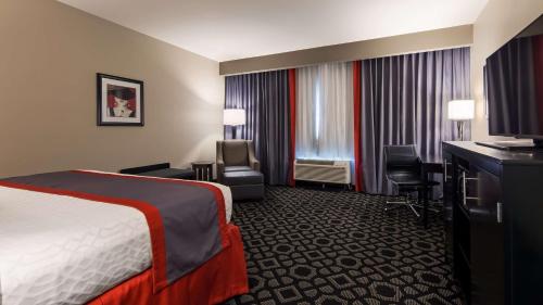 a hotel room with a bed and a desk at Best Western Plus Laredo Inn & Suites in Laredo