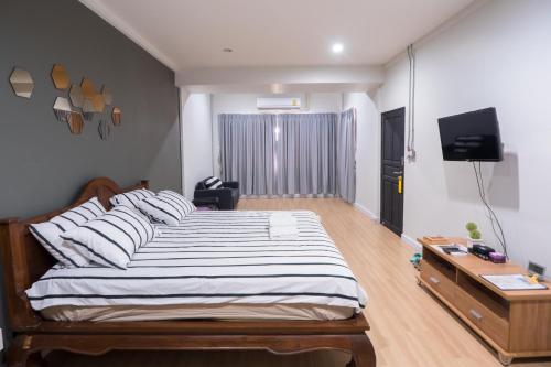 Llit o llits en una habitació de Pann Residence