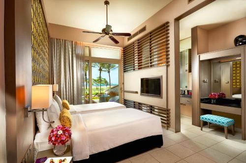 Postel nebo postele na pokoji v ubytování Sentido Heritance Negombo