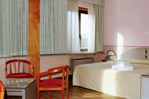Cama o camas de una habitación en Hotel Albatros