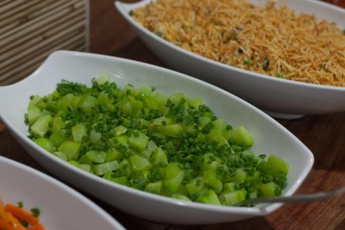 a bowl of broccoli and other bowls of food on a table at Hotel Marina Torrano in Trindade