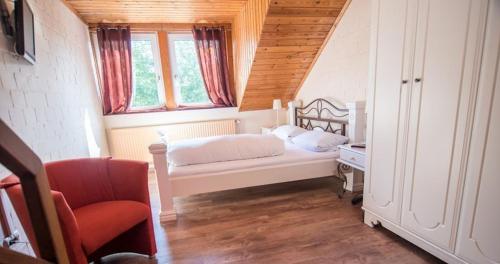 Postel nebo postele na pokoji v ubytování Zur Schanze Holtgast-Apen