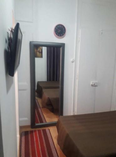 a mirror in front of a room with some beds at Hostal Africa Do Sul in Lisbon