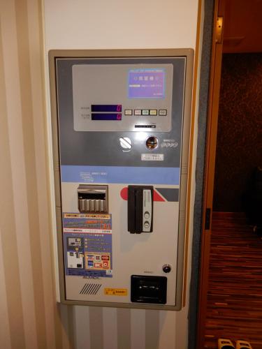 a vending machine with a credit card on it at Hotel Shindbad Aomori -Love Hotel- in Aomori