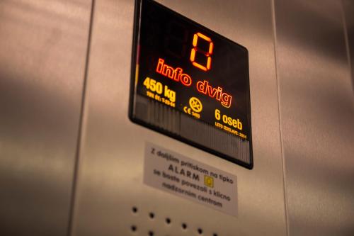 a close up of a sign on an elevator at Hotel Krona Domžale in Domžale
