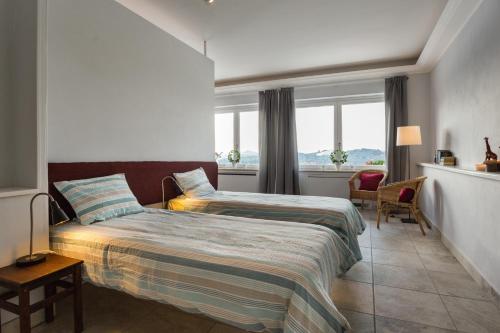 Кровать или кровати в номере Villa Collebelvedere - Home Restaurant