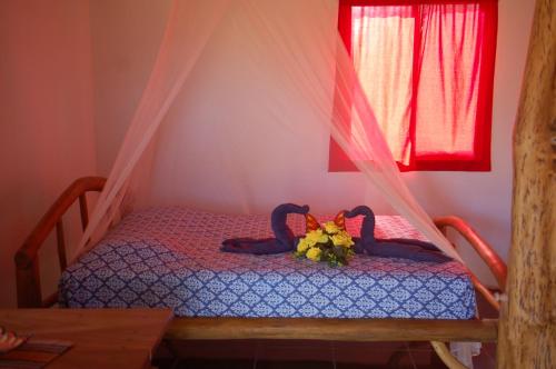 เตียงในห้องที่ Casa bungalow Ital-Tico