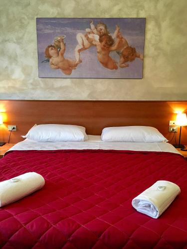 Uma cama ou camas num quarto em Hotel Forum