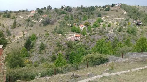 a hillside with houses on the side of it at Casa en La Cumbrecita in La Cumbrecita