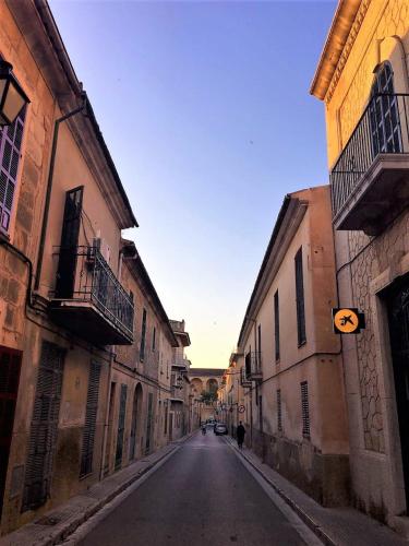 an empty street in an alley with buildings at 229 Casa Es Forn ETV10429 by Mallorca Charme in Petra