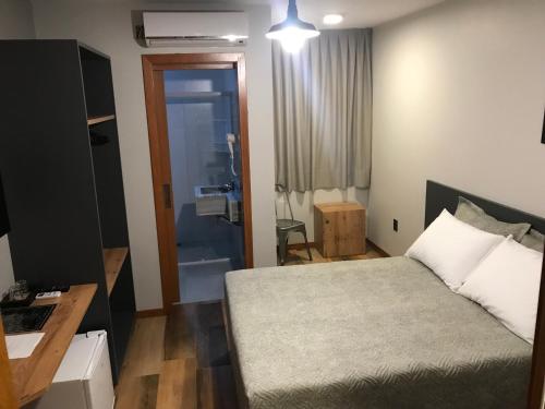 Postel nebo postele na pokoji v ubytování Hotel Blumenhof Balneário Camboriú