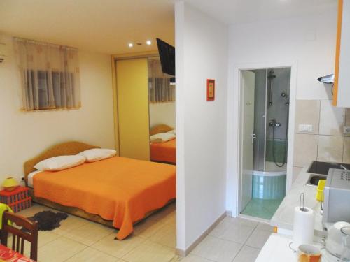 מיטה או מיטות בחדר ב-Apartments Villa Dube