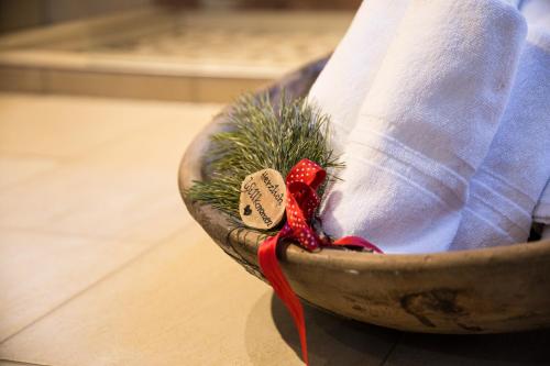 a person is sitting in a bowl with a christmas tree at Buxgarten Ferienhof in Oetz