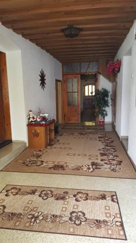 a hallway of a house with a rug on the floor at Privatzimmer Dimitrova in Ulrichsberg