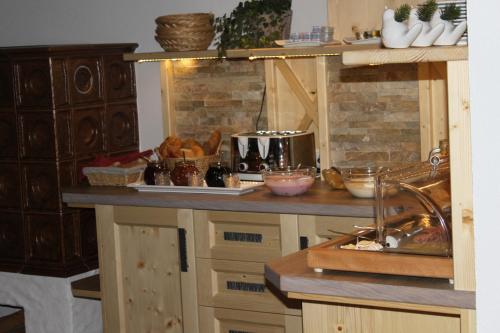 a kitchen with a counter with some food on it at Haus Alexander in Schladming