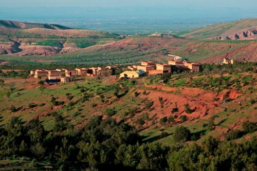 an aerial view of a village on a mountain at Terres d'Amanar in Tahannout