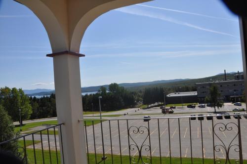 a view of a parking lot from a balcony at Hotel Motel Le Château in Lac-Mégantic