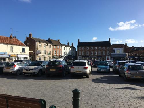 a bunch of cars parked in a parking lot at OurHaus in Beverley