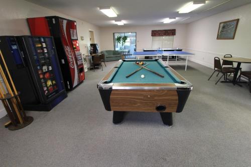 a room with a pool table and some machines at The Shores at Lake Travis, a VRI resort in Lago Vista