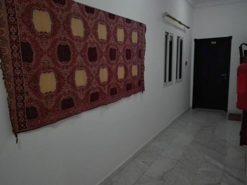 a room with a large painting on a wall at Salalah Beach Villas in Salalah