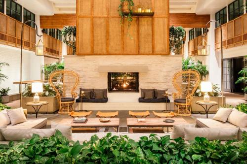 
a living room filled with furniture and a fire place at The Scott Resort & Spa in Scottsdale
