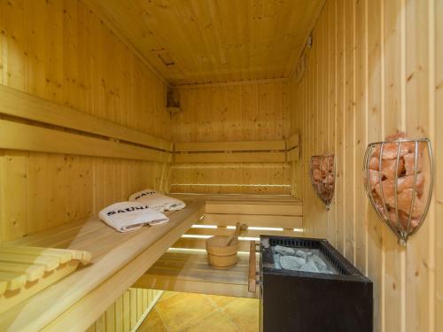 a sauna with two beds and towels in it at Willa Pod Kozińcem in Czarna Góra
