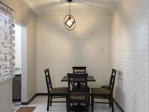 a dining room with a table and chairs at D’Savoy @ Famosa by SH in Melaka