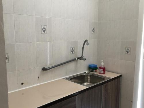a bathroom with a sink and a counter top at D’Savoy @ Famosa by SH in Melaka