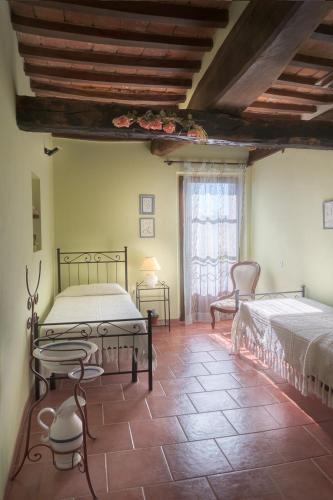 Postel nebo postele na pokoji v ubytování Agriturismi Farina