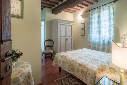 Postel nebo postele na pokoji v ubytování Agriturismi Farina
