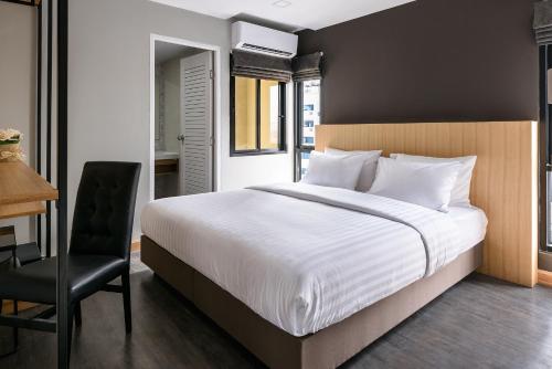 Ένα ή περισσότερα κρεβάτια σε δωμάτιο στο Travelier Hostel