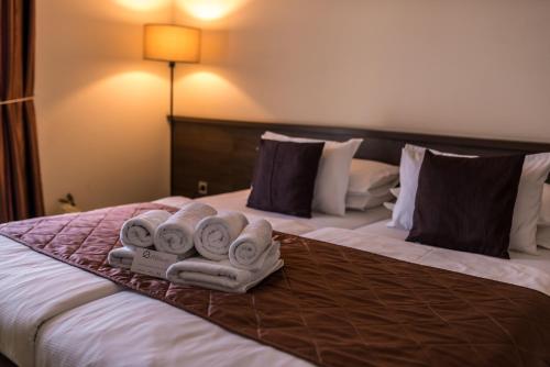 Cama o camas de una habitación en Hotel Emporium