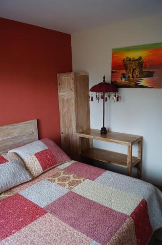 Postel nebo postele na pokoji v ubytování Le Gîte du Koniambo