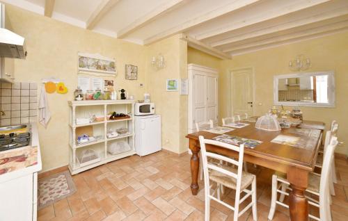 a kitchen with a table and chairs in a room at B&B Le Colline di Bana Camogli in Camogli