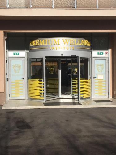a store front with yellow doors on a building at Premium Wellness Institute in Bucharest