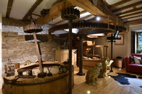 a living room with a large room with animals in it at Low Mill Guesthouse in Bainbridge