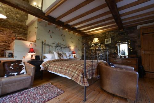 Ένα ή περισσότερα κρεβάτια σε δωμάτιο στο Low Mill Guesthouse