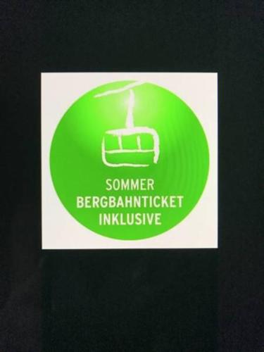 a green and white sign with a picture of a bed gmaxwell at Hotel Engel in Oberstdorf