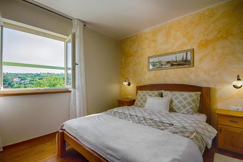 Postel nebo postele na pokoji v ubytování Villa Fundica