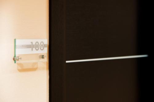 an open door with a temperature sign on it at Hotel La Campagnola in Fucecchio